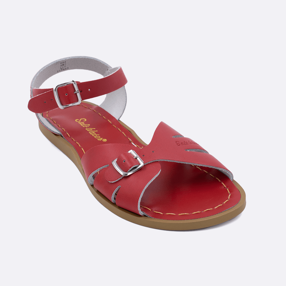 One 900 Classic style sandal color red. Facing left to right diagonally. 	Adult Size.	