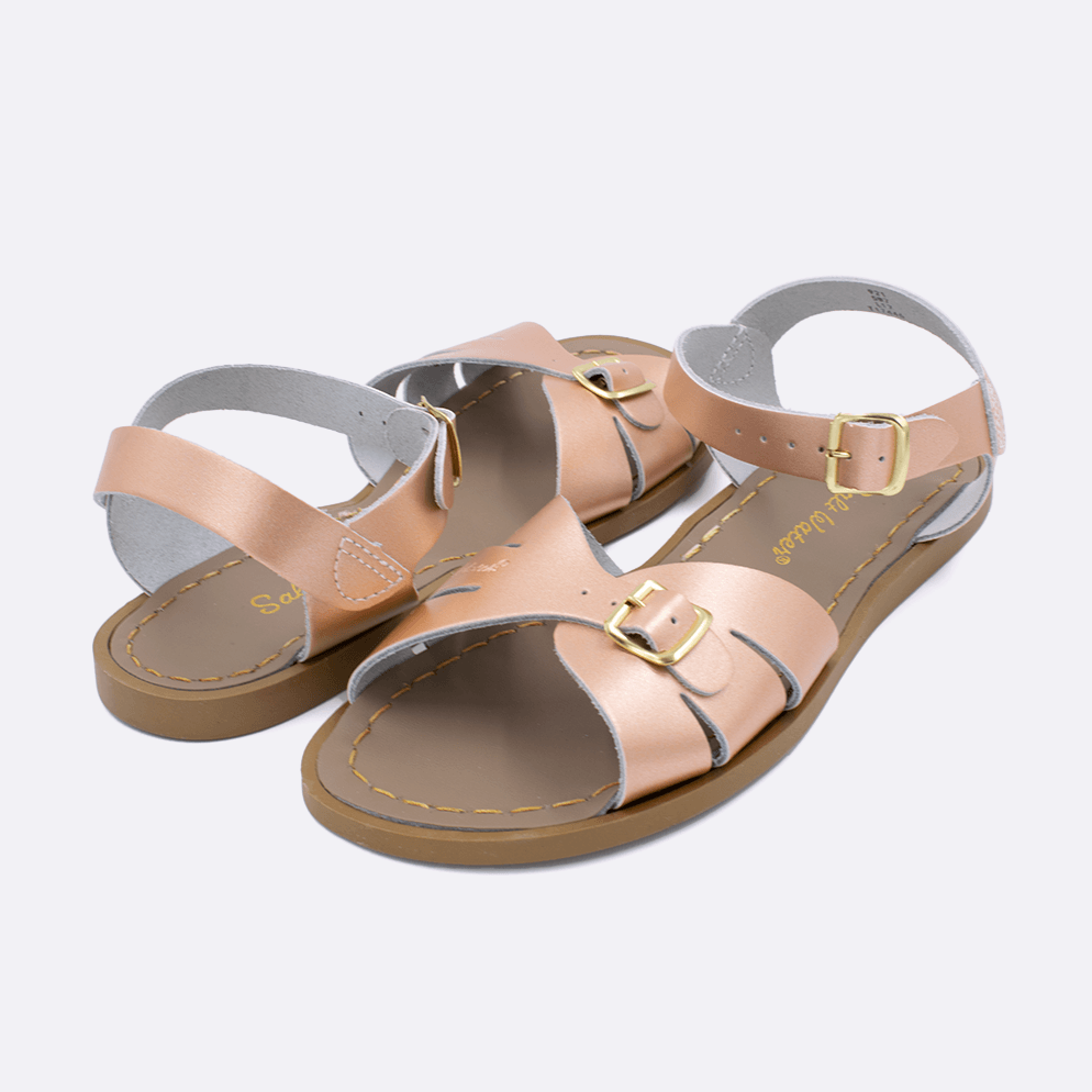 Two 900 Classic style sandal color rose gold. Both pushed together facing the camera diagonally.	Adult Size.	