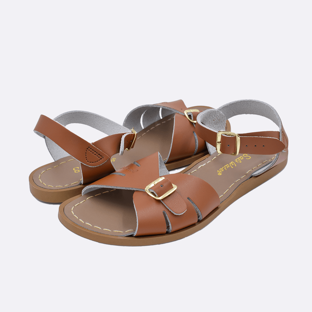 Two 900 Classic style sandal color tan. Both pushed together facing the camera diagonally.	Adult Size.