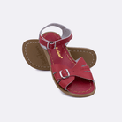 Two 900 Classic style sandals color red.  One standing with the sole facing the camera. The second is laying diagonally over the top left edge of the sole.	Little Kid Size.