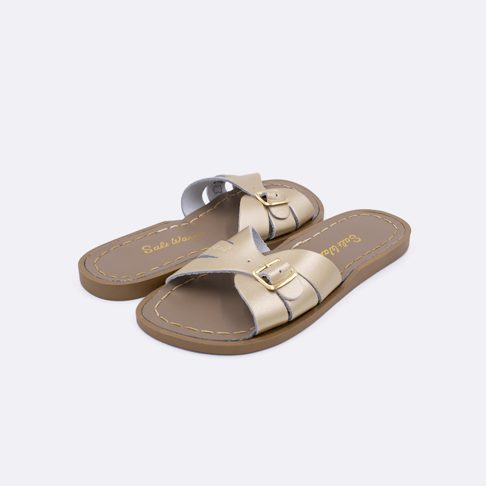Two 9900 Classic Slide style sandal color gold. Both pushed together facing the camera diagonally.	Little Kid Size.