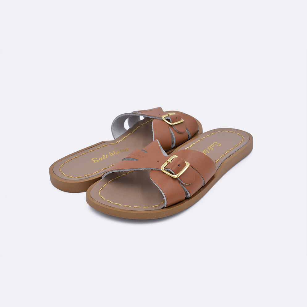 Two 9900 Classic Slide style sandal color tan. Both pushed together facing the camera diagonally.	Little Kid Size.