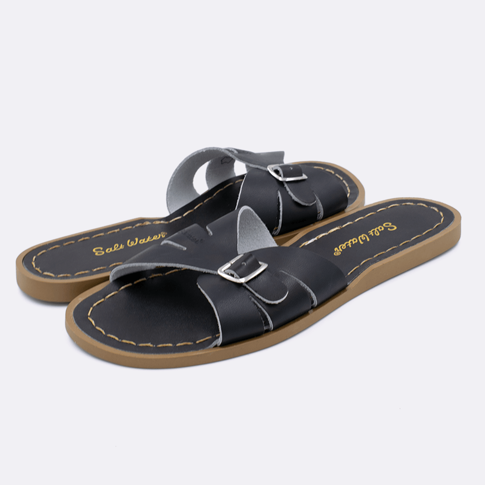 Two 9900 Classic Slide style sandal color black. Both pushed together facing the camera diagonally.	Adult Size.