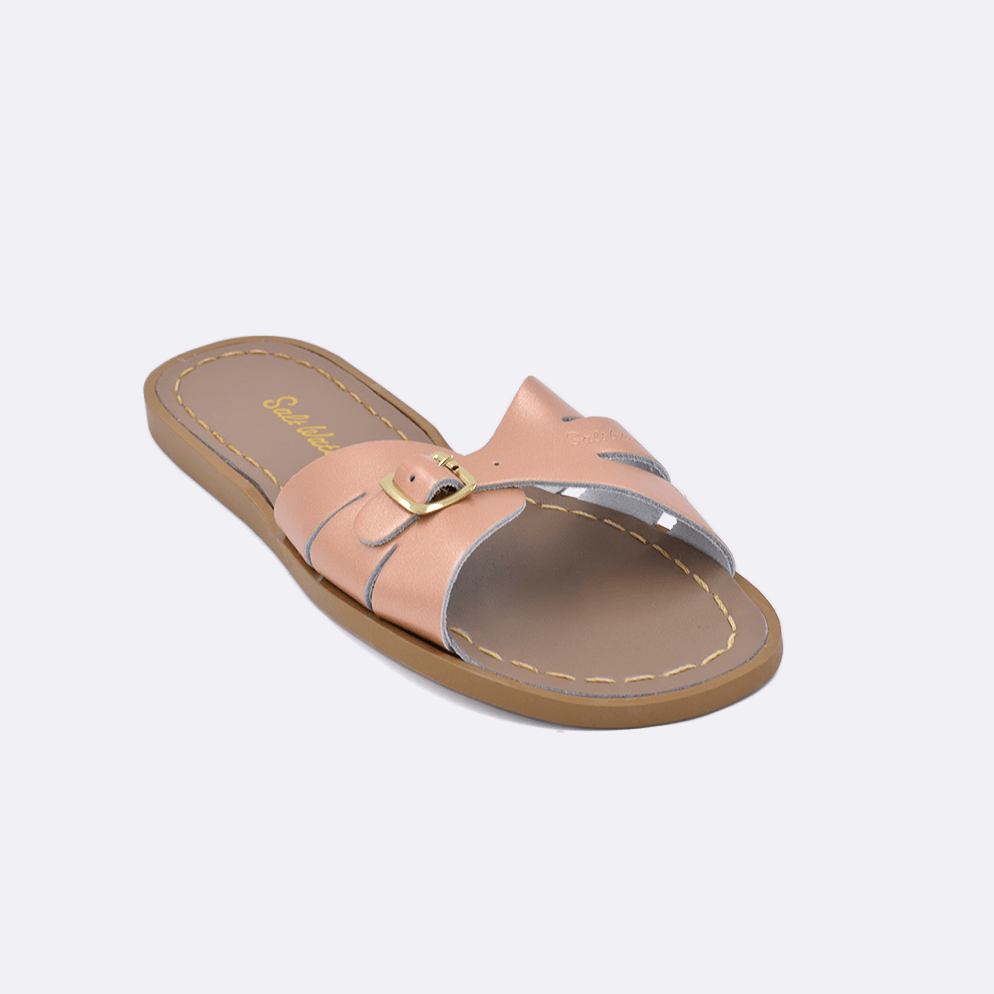 One 9900 Classic Slide style sandal color rose gold. Facing left to right diagonally. 	Adult Size.