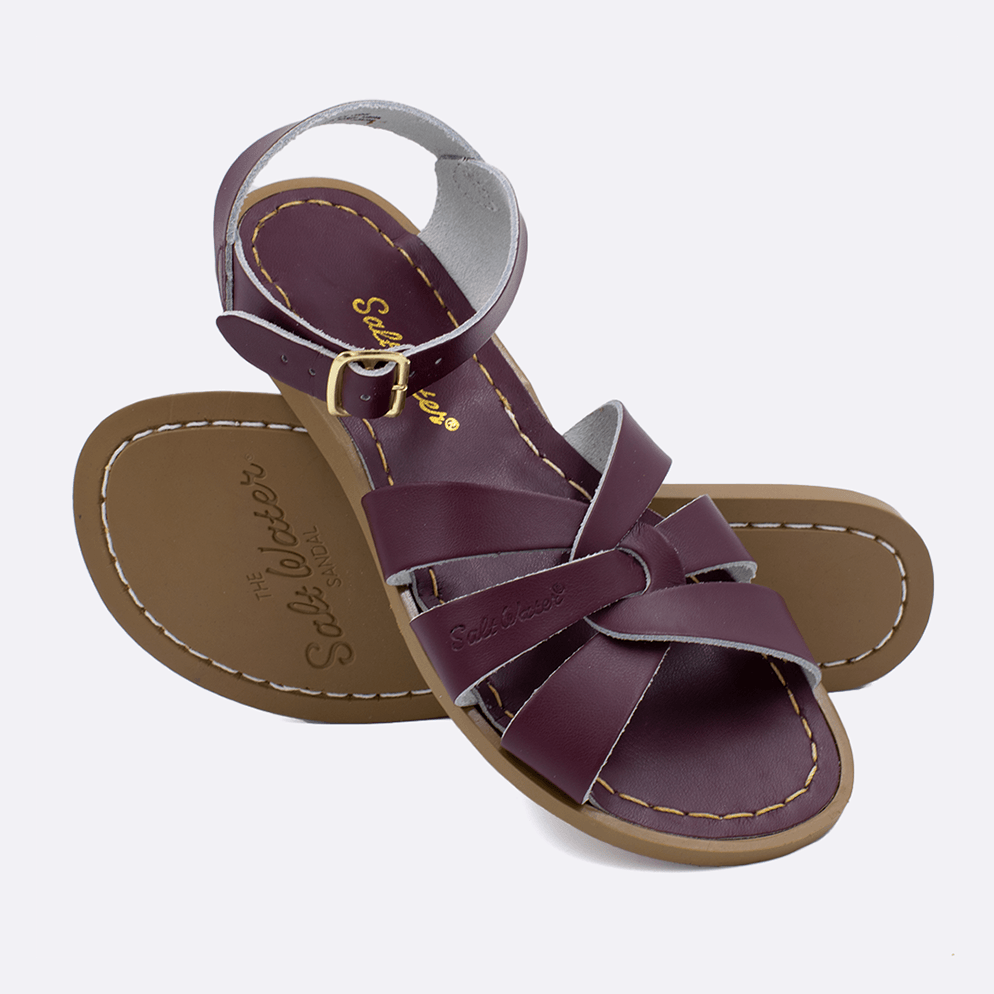 Two 800 Original style sandals color claret.  One standing with the sole facing the camera. The second is laying diagonally over the top left edge of the sole.	Adult Size.