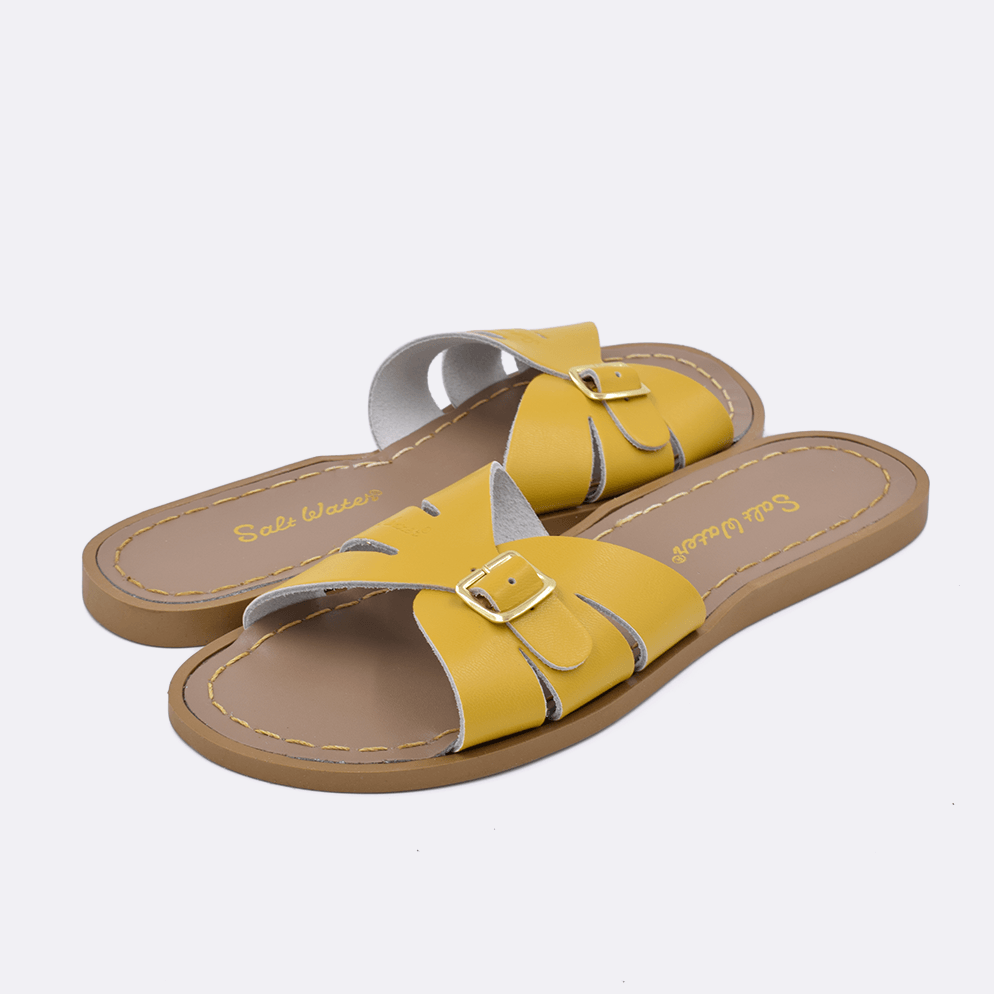 Two 9900 Classic Slide style sandal color mustard. Both pushed together facing the camera diagonally.	Adult Size.