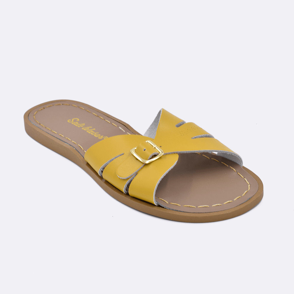 One 9900 Classic Slide style sandal color mustard. Facing left to right diagonally. 	Adult Size.