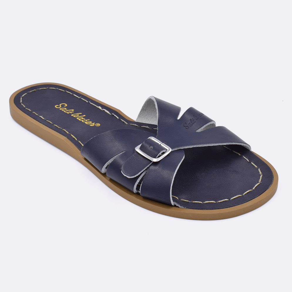 One 9900 Classic Slide style sandal color navy. Facing left to right diagonally. 	Adult Size.