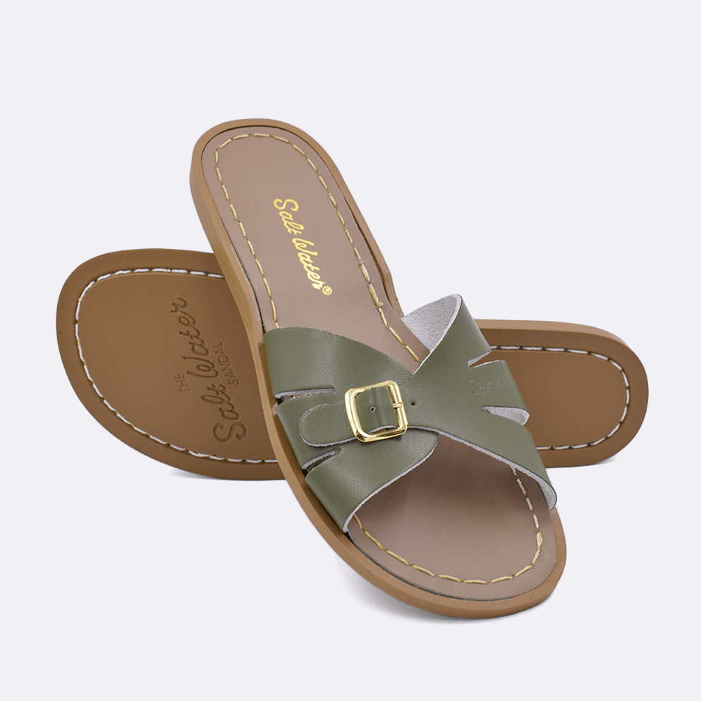 Two 9900 Classic Slide style sandals color olive.  One standing with the sole facing the camera. The second is laying diagonally over the top left edge of the sole.	Adult Size.