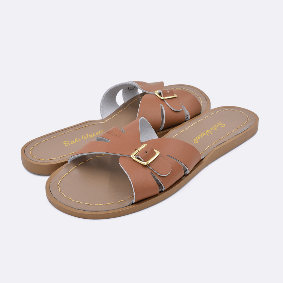 Two 9900 Classic Slide style sandal color tan. Both pushed together facing the camera diagonally.	Adult Size.